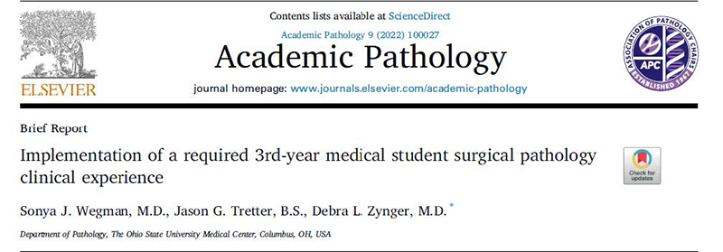 medical students attending a lecture given by a pathology faculty member.